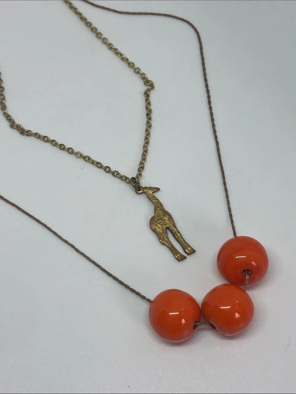 Gold Giraffe Pendant Necklace with Bright Orange Bead Strand